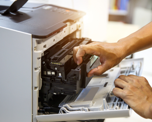 Technician hand open cover printer photocopier